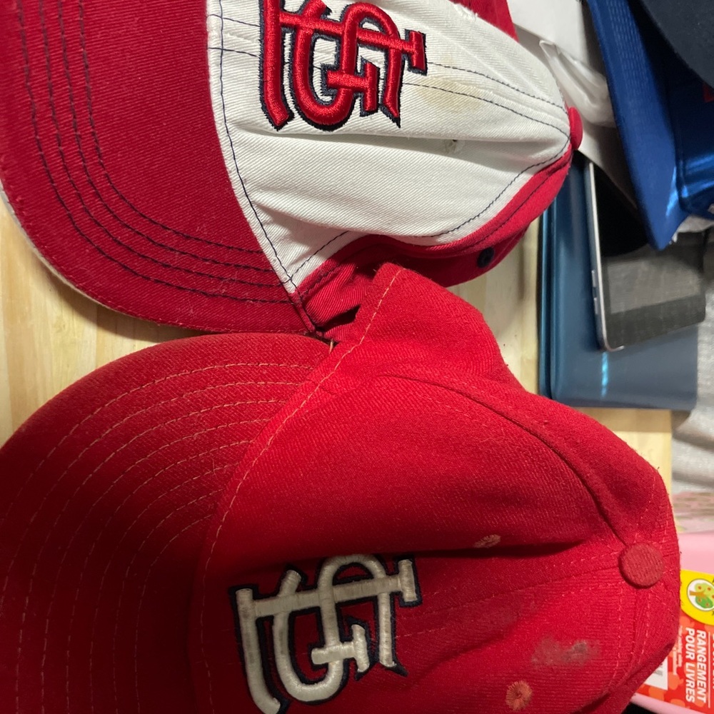 Two hats one youth and one adult. Stlouis cardinals